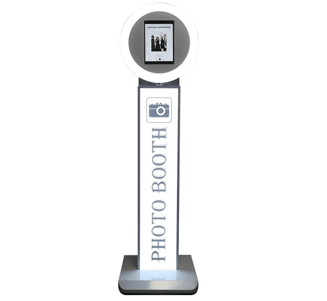 Photo booth structure with illuminated design showcasing 'PHOTO BOOTH' text and digital images, perfect for events.