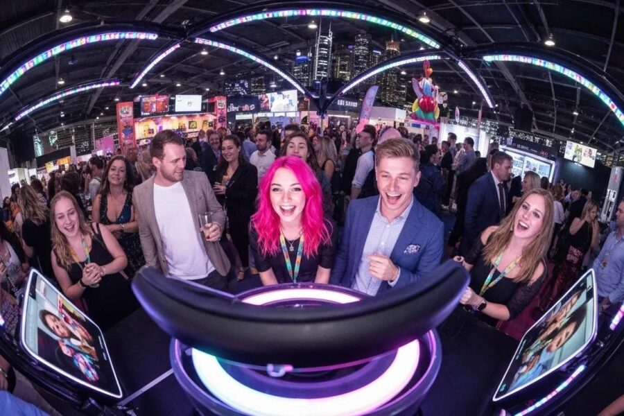 Guests enjoying a 360 photo booth at a vibrant Sydney event