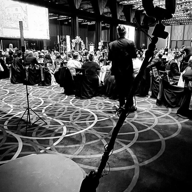 360 video booth at a corporate event with professionals engaging