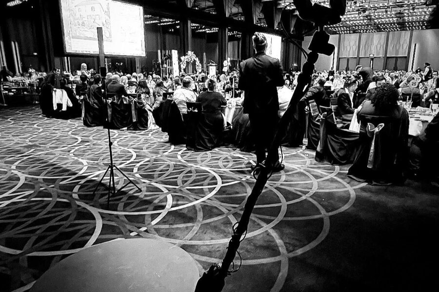 360 video booth at a corporate event with professionals engaging