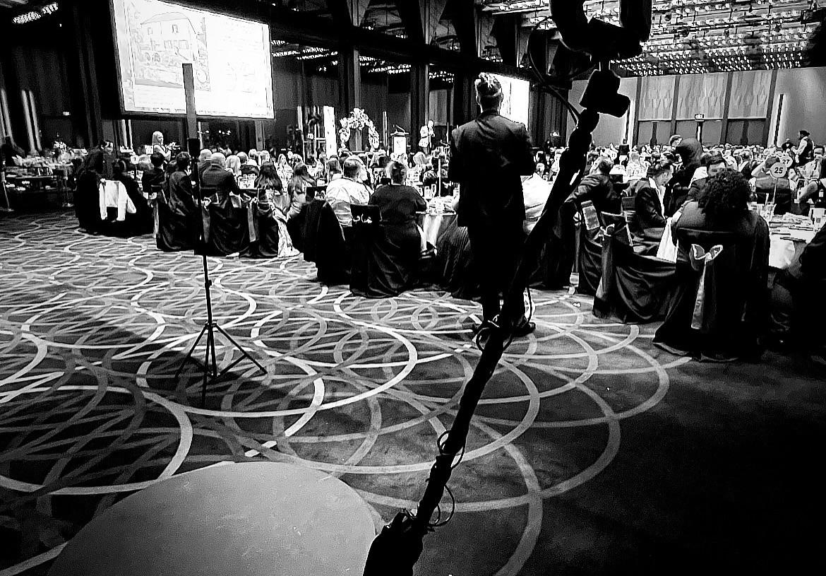 Guests interacting with a virtual tour display at an event venue