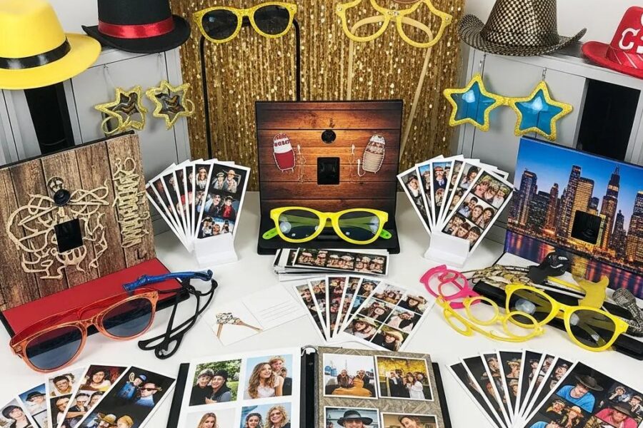 Display of various photo booth packages with props and backdrops
