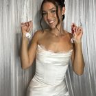 Wedding guest holding her Halo360 Keychain Station keepsakes