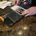 Halo360 attendant assisting a guest with her polaroid print
