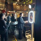 Guests using the Halo360 photo booth at a branded activation