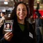 Guest holding her personalised Halo360 polaroid passport print