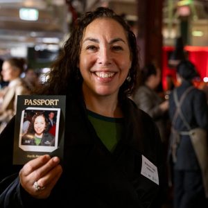 Guest holding her personalised Halo360 polaroid passport print